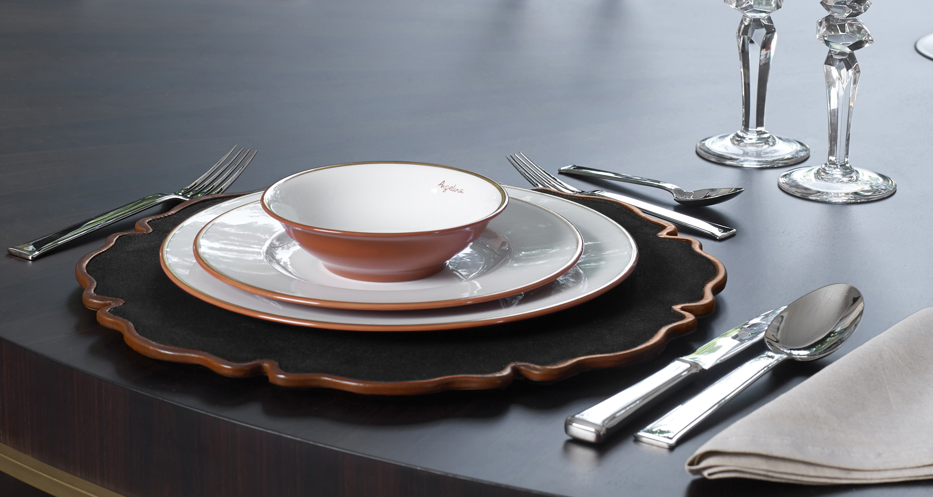 Detail of Ibisco, a leather or velvet underplate shaped like a flower, from Promemoria's catalogue | Promemoria