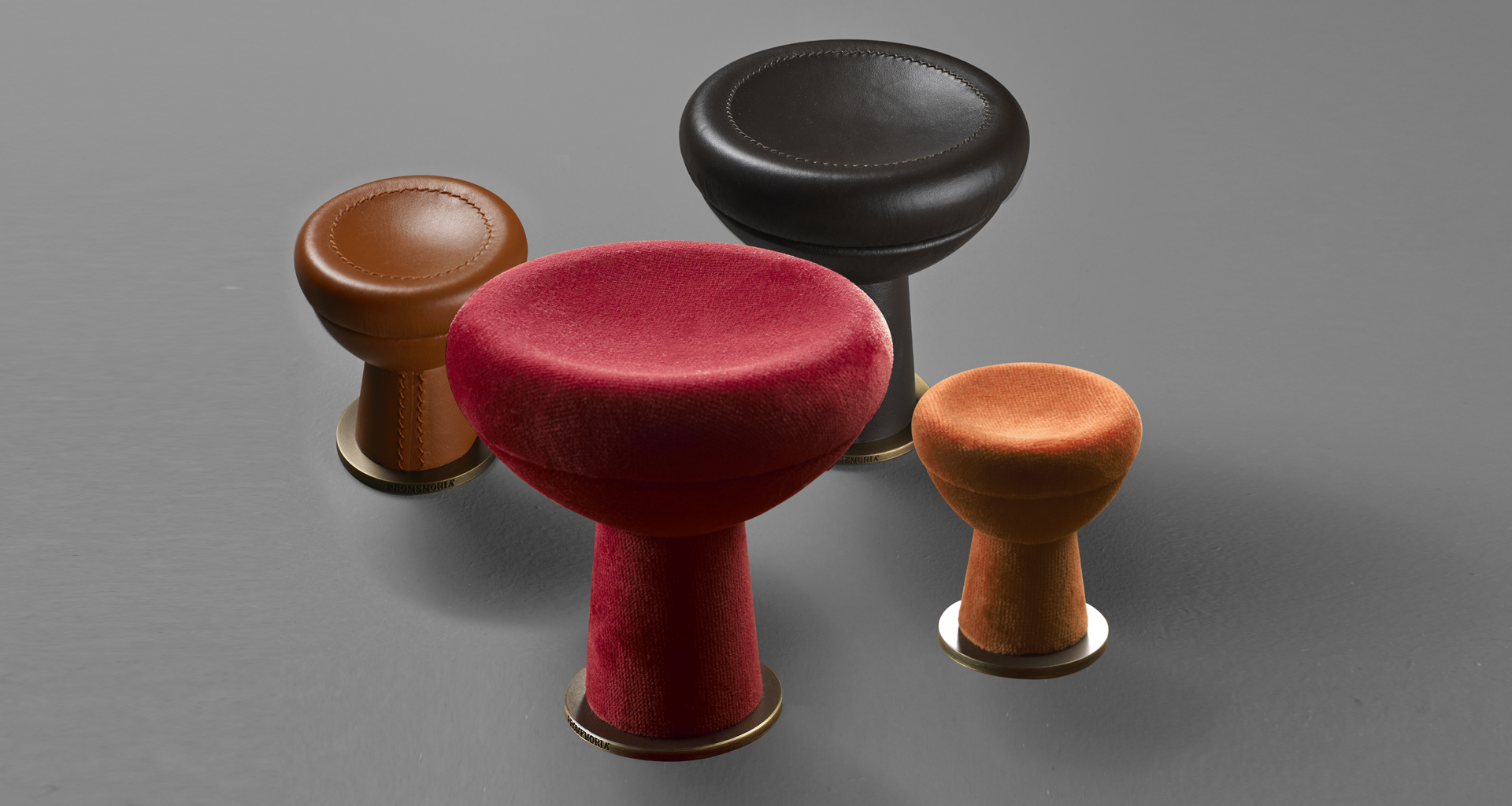 Bottone is a fabric, leather or wooden wall hanger shaped like a button, from Promemoria's catalogue | Promemoria