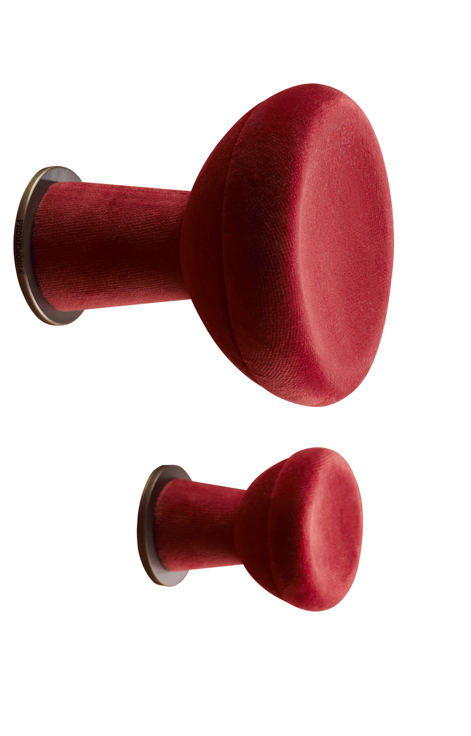 Bottone is a fabric or leather wall hanger shaped like a button, from Promemoria's catalogue | Promemoria