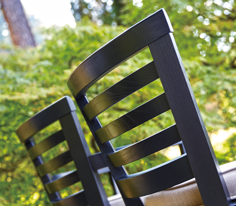 Detail of Varenna, an outdoor wooden chair with or withour armrests and fabric cushion, from Promemoria's outdoor catalogue | Promemoria