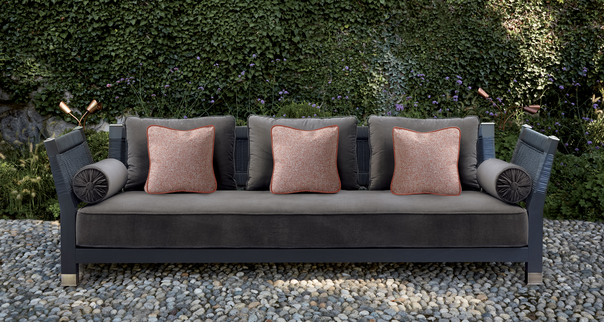 Moltrasio is an outdoor wooden sofa with bronze feet and details, from Promemoria's outdoor catalogue | Promemoria