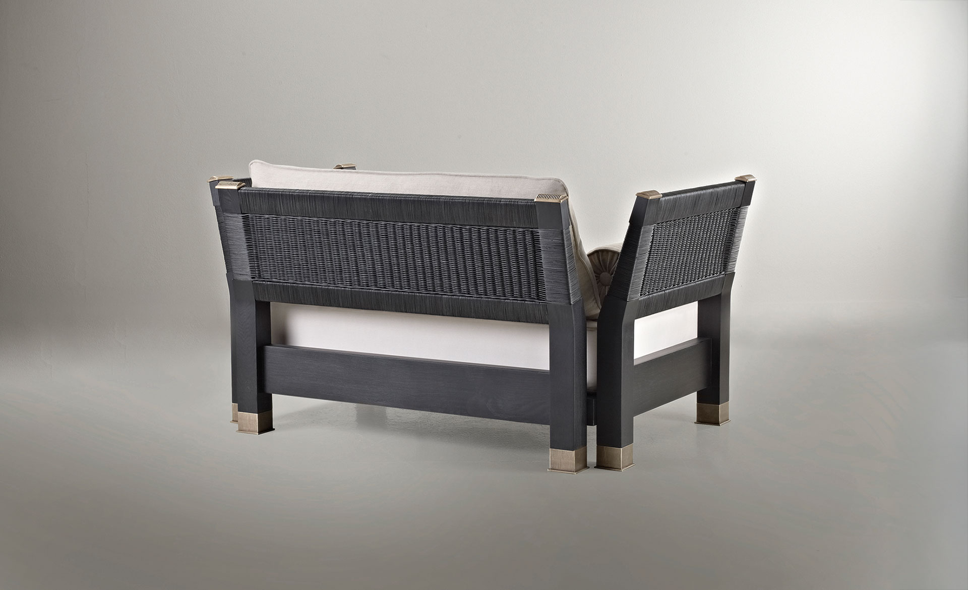 Moltrasio is an outdoor wooden sofa with bronze feet and details, from Promemoria's outdoor catalogue | Promemoria