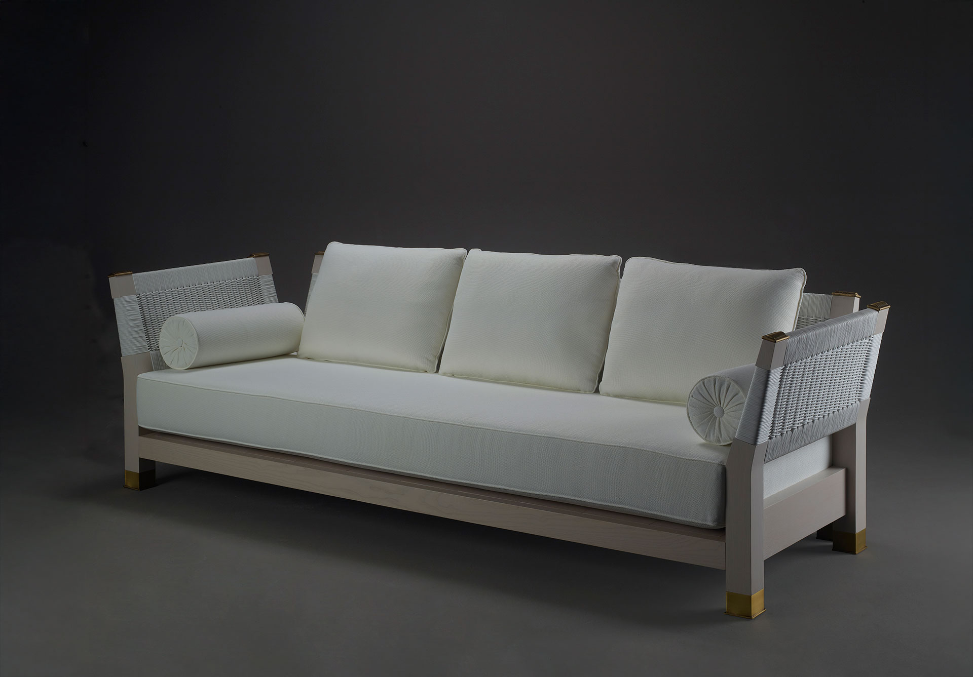 Moltrasio is an outdoor wooden sofa with bronze feet and details, from Promemoria's outdoor catalogue | Promemoria