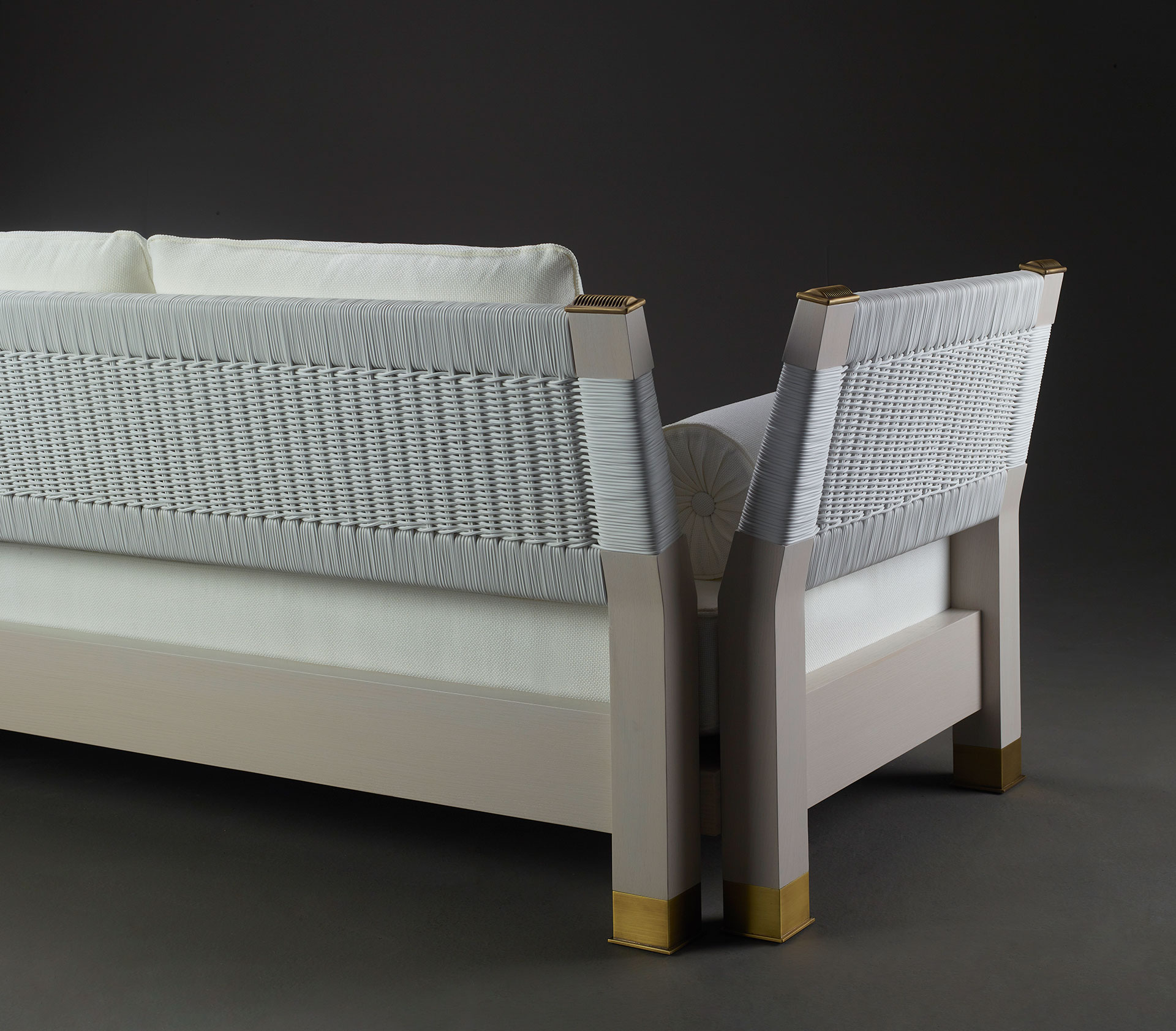 Moltrasio is an outdoor wooden sofa with bronze feet and details, from Promemoria's outdoor catalogue | Promemoria