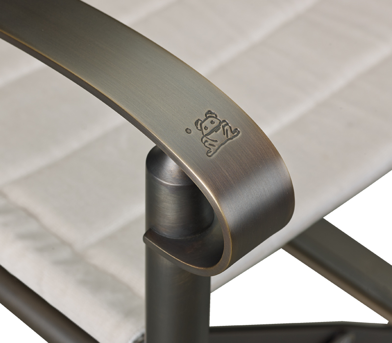 Detail of Quentin, an outdoor folding bronze sofa, covered in fabric or leather, from Promemoria's outdoor catalogue | Promemoria