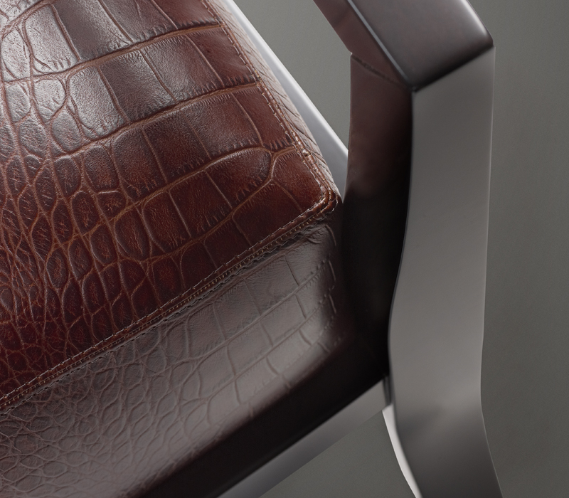 Detail of Africa, a wooden armchair covered in fabric or leather, from Promemoria's catalogue | Promemoria