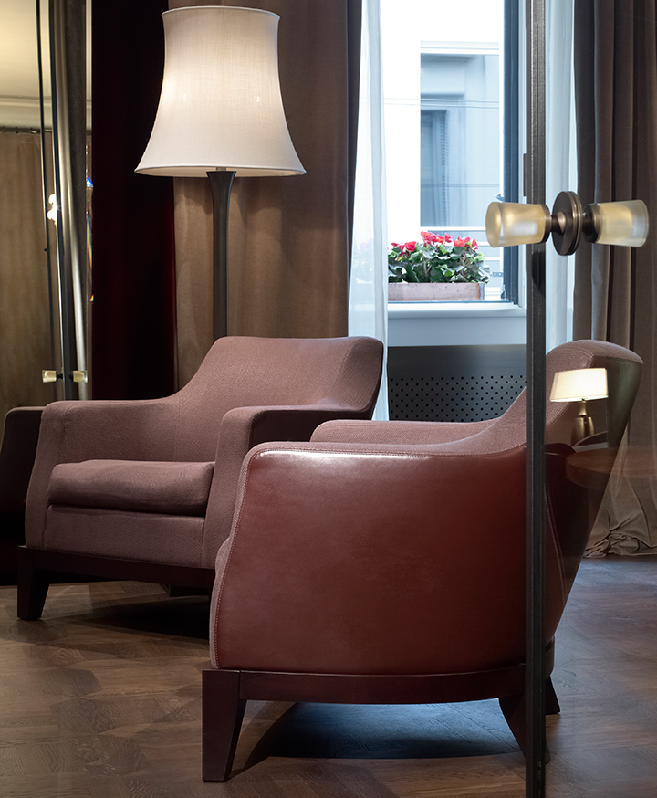 Aziza is a wooden armchair covered in fabric or leather, from Promemoria's catalogue | Promemoria