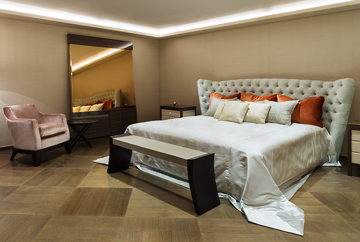 Aziza is a wooden armchair covered in fabric or leather, from Promemoria's catalogue | Promemoria