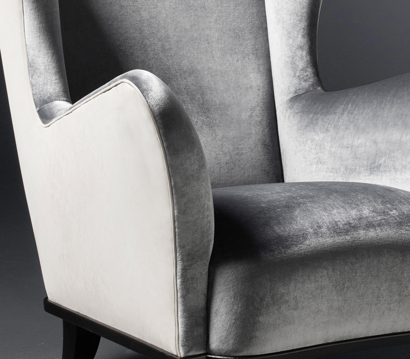 Detail of Bluette, a wooden armchair covered in fabric or leather, from Promemoria's Night Tales collection | Promemoria