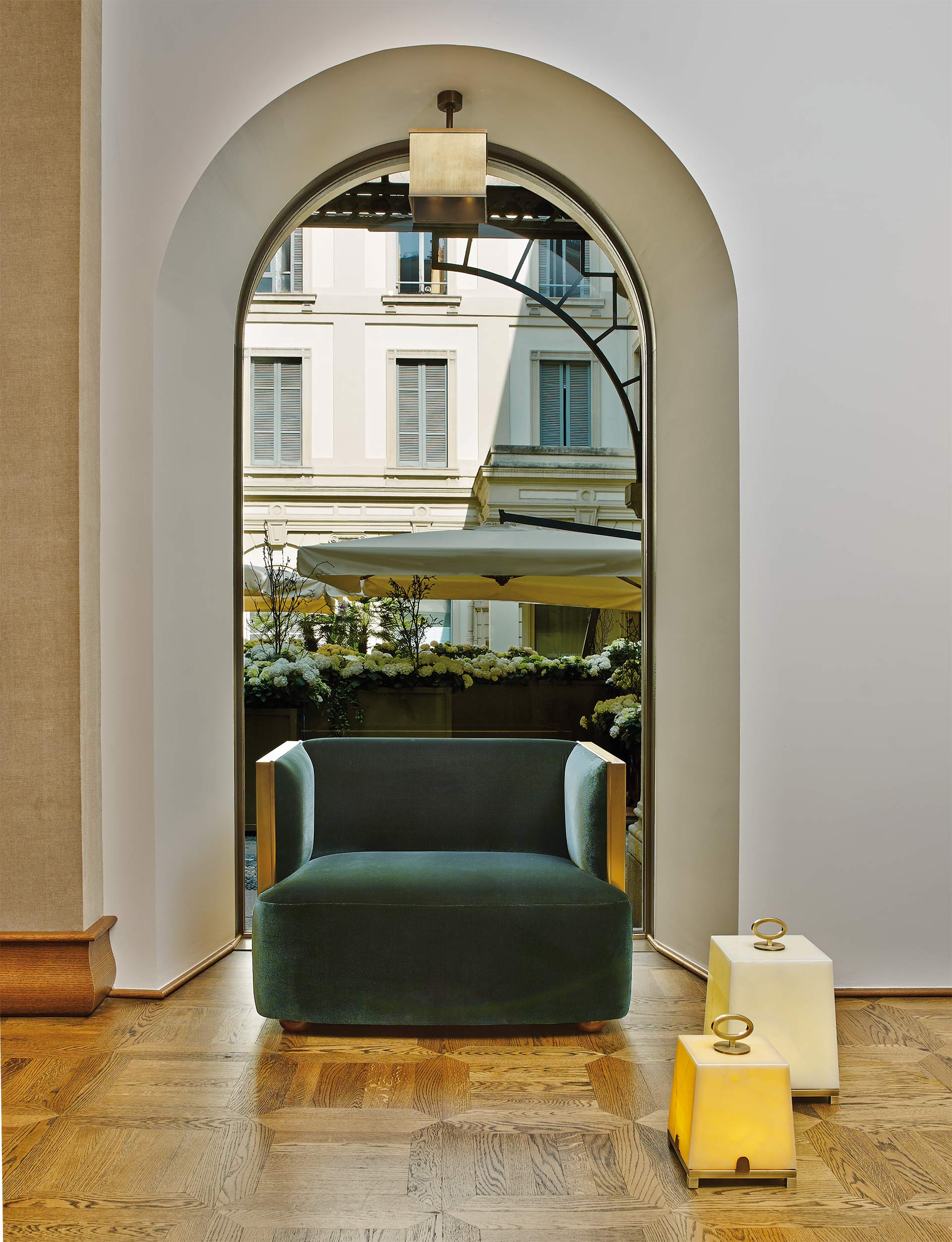Boccaccio is a bronze armchair covered in fabric or leather, from Promemoria's catalogue | Promemoria