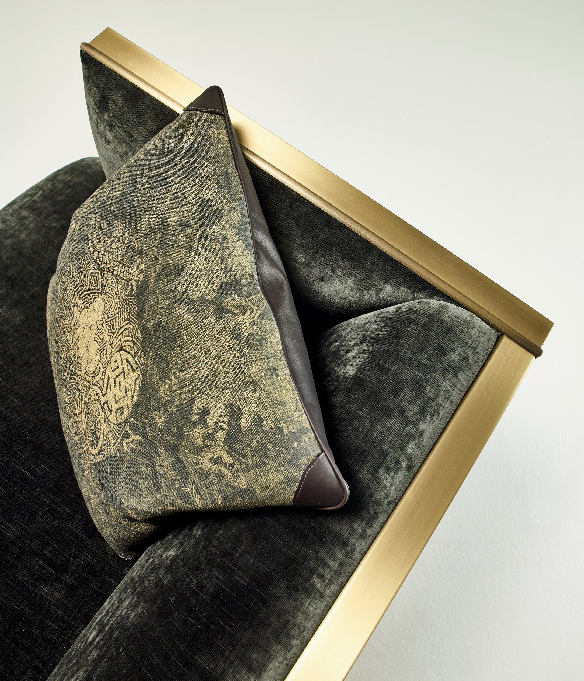 Boccaccio is a bronze armchair covered in fabric or leather, from Promemoria's catalogue | Promemoria