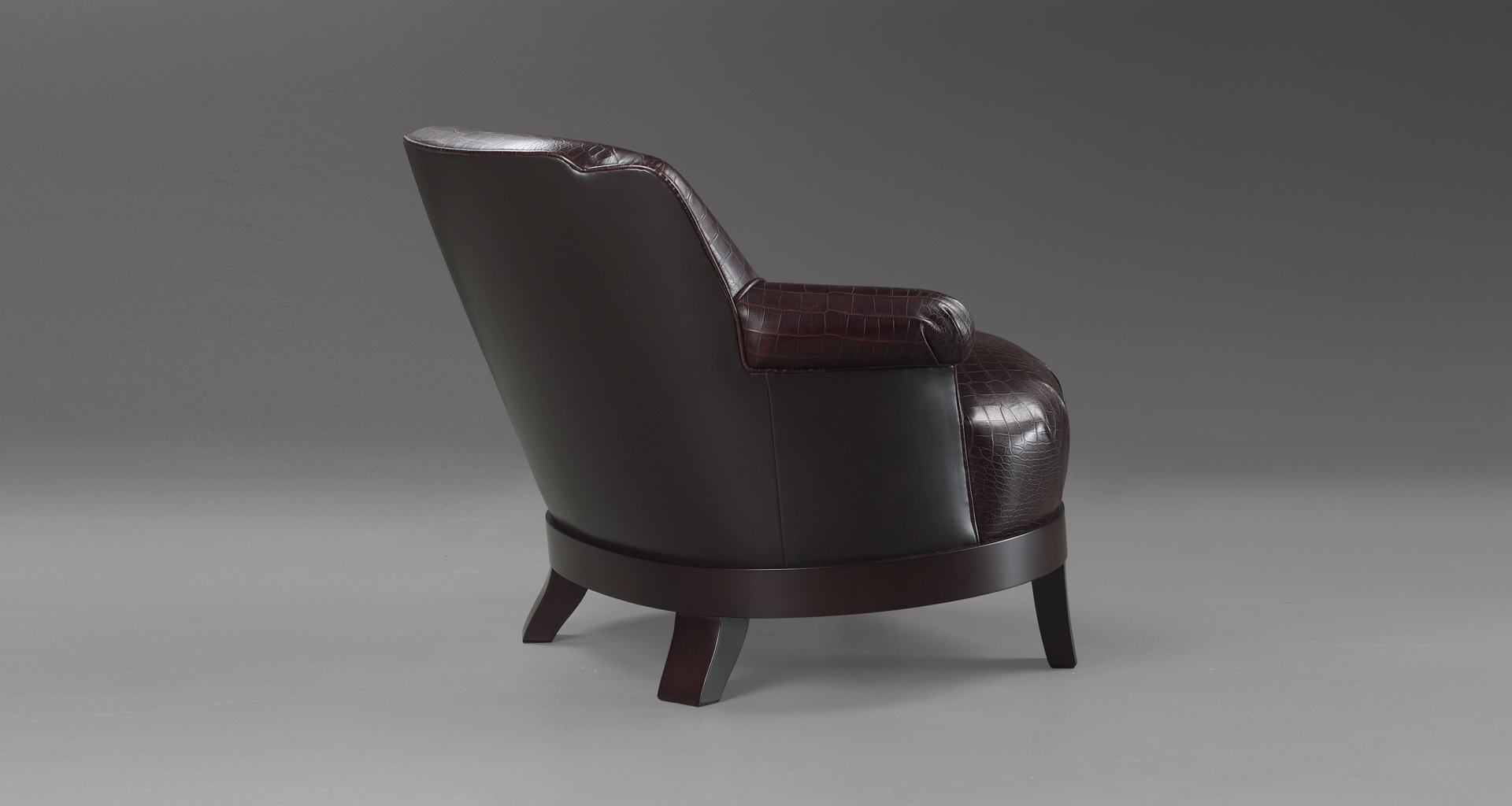 Gacy is a wooden armchair covered in fabric or leather, from Promemoria's catalogue | Promemoria