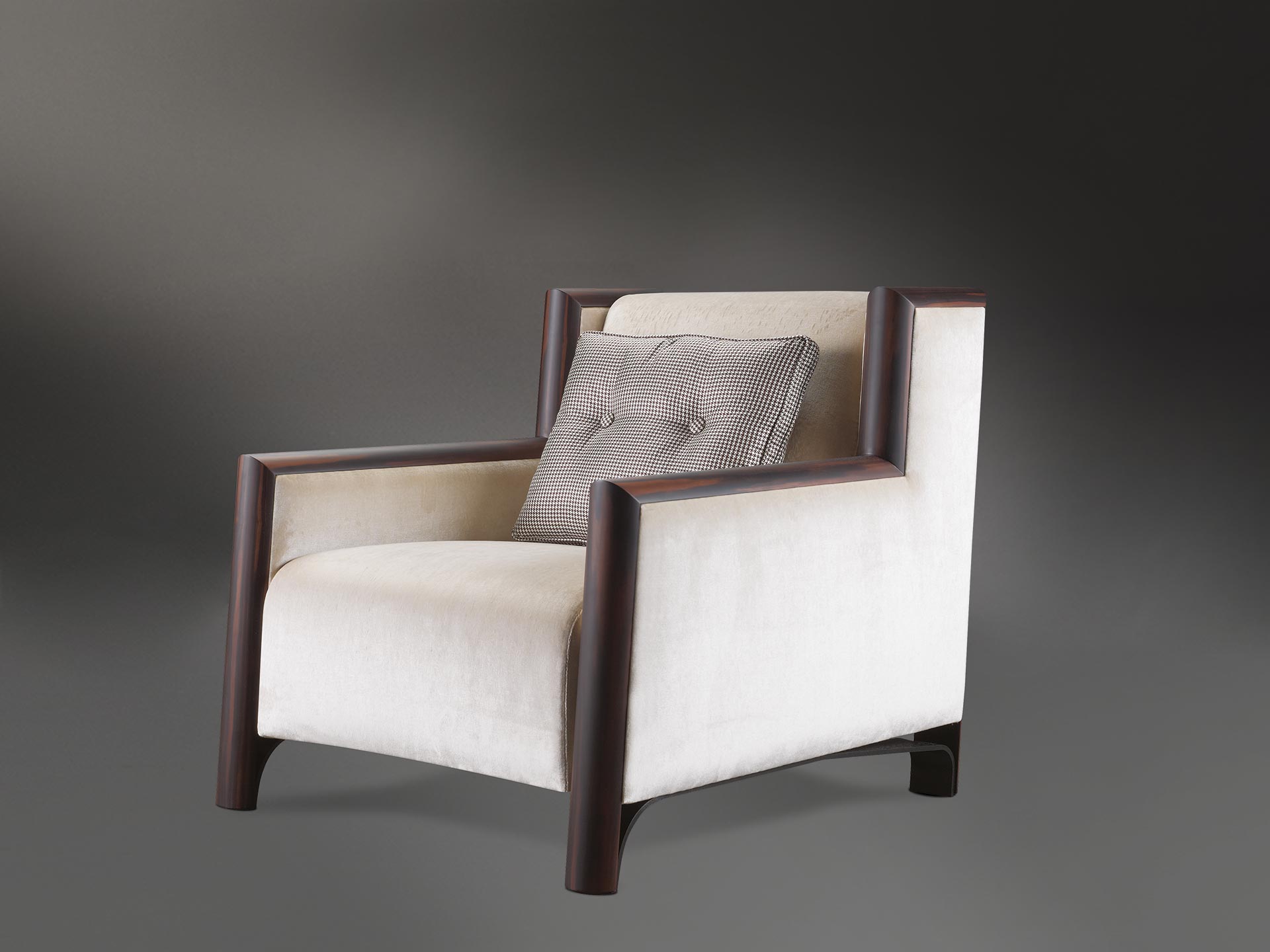 Ginevra is a wooden armchair covered in leather or fabric with bronze feet, from Promemoria's catalogue | Promemoria