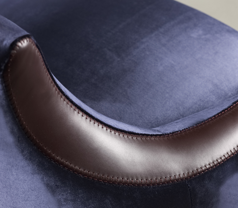 Leather detail of Gioconda and Giocondina, two fabric armchairs from Promemoria's catalogue | Promemoria