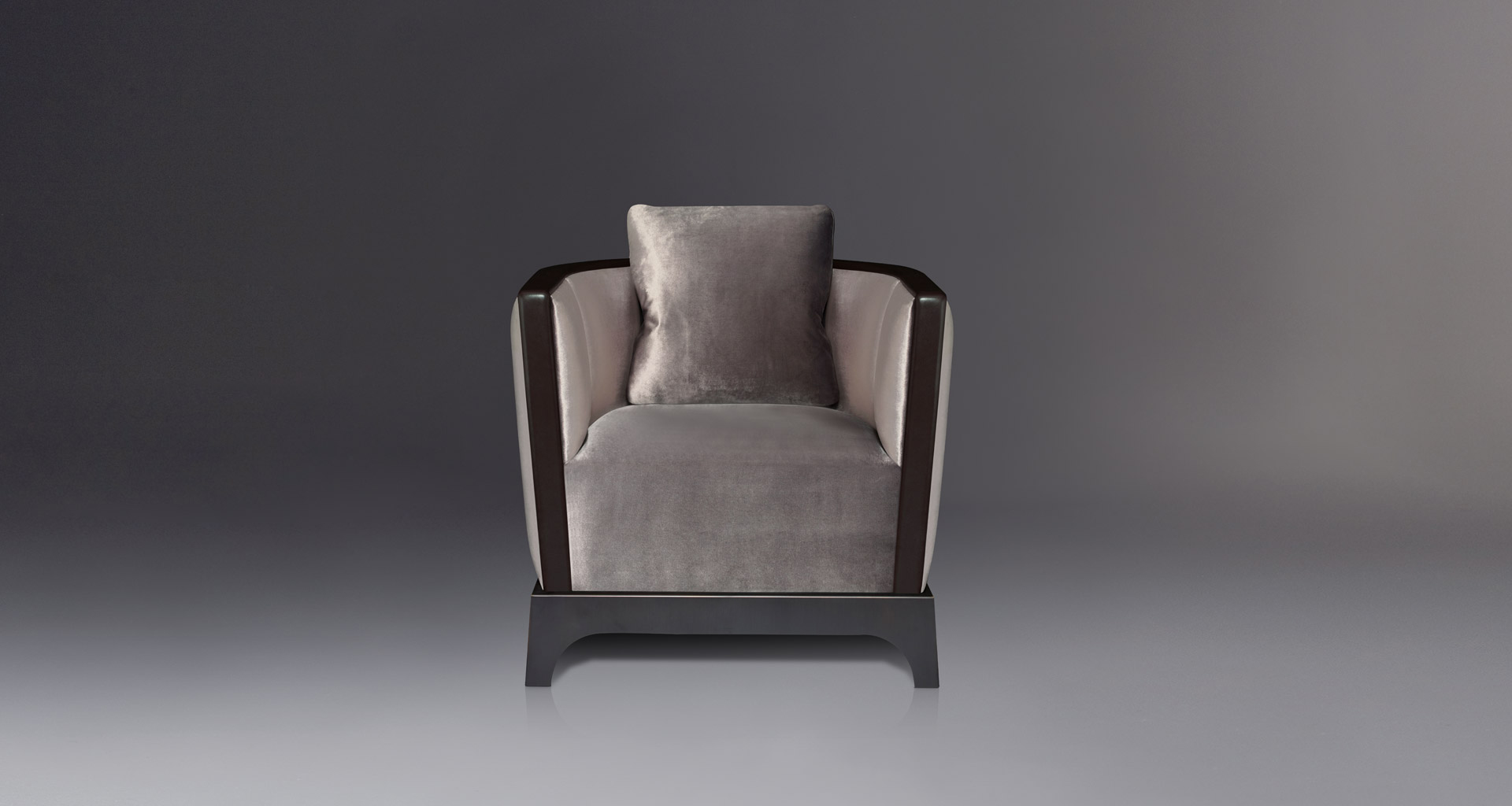 Grosvenor is a wooden armchair with fabric covering and leather details, from Promemoria's The London Collection | Promemoria