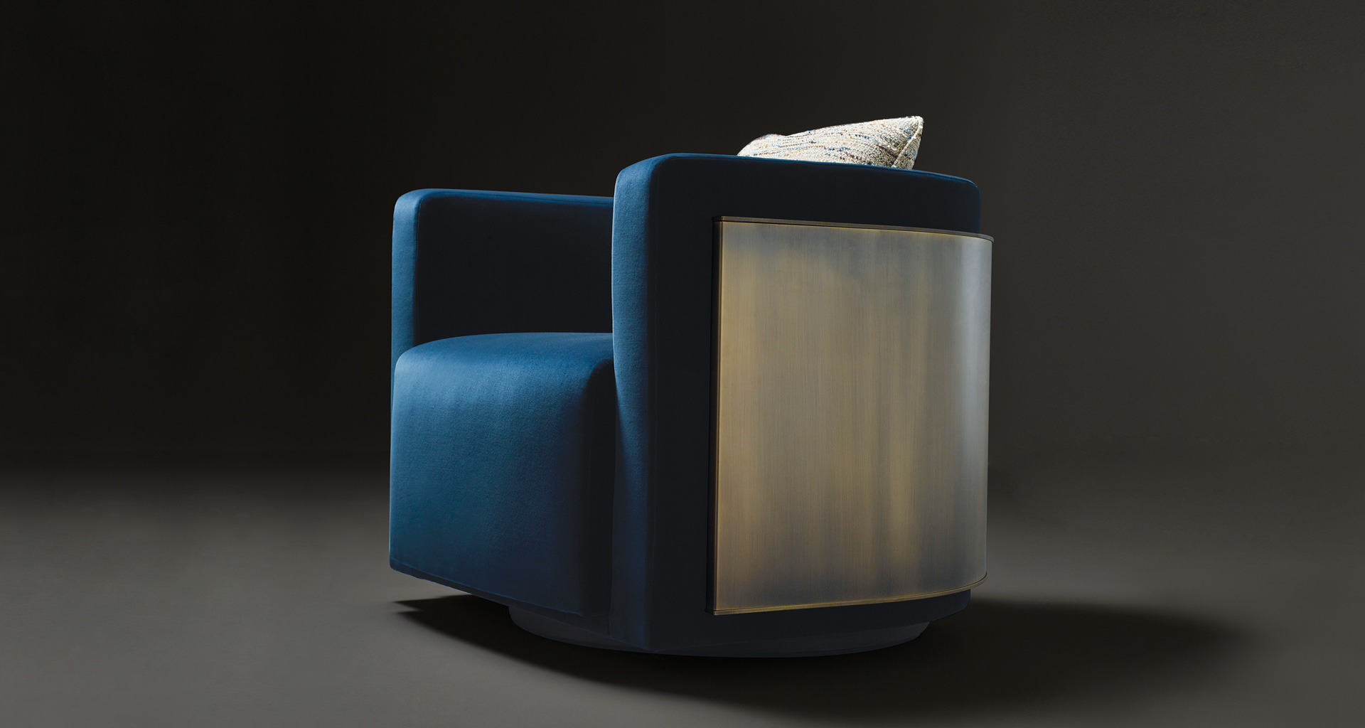 Pervinca is a swivel bronze armchair with a wooden base and fabric covering, from Promemoria's Amaranthine Tales collection | Promemoria
