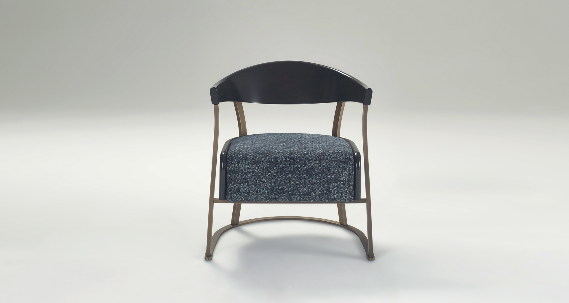 Rachele is a bronze armchair covered in leather, from Promemoria's catalogue | Promemoria