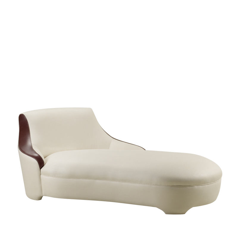 Gioconda is a chaise longue convered in fabric with leather details, from Promemoria's catalogue | Promemoria