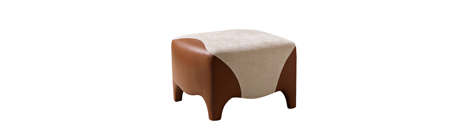 /mediaDetail%20of%20Club,%20a%20pouf%20covered%20in%20fabric%20and%20leather,%20from%20Promemoria's%20catalogue%20|%20Promemoria