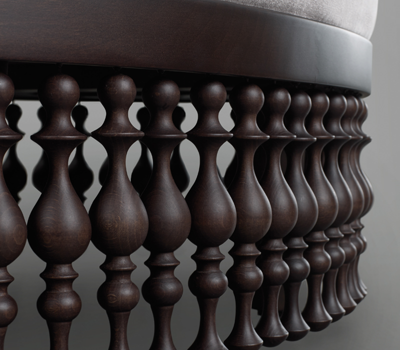 Wooden fringed base detail of Istanbul, a fabric or leather pouf from Promemoria's Capsule Collection by Bruno Moinard | Promemoria