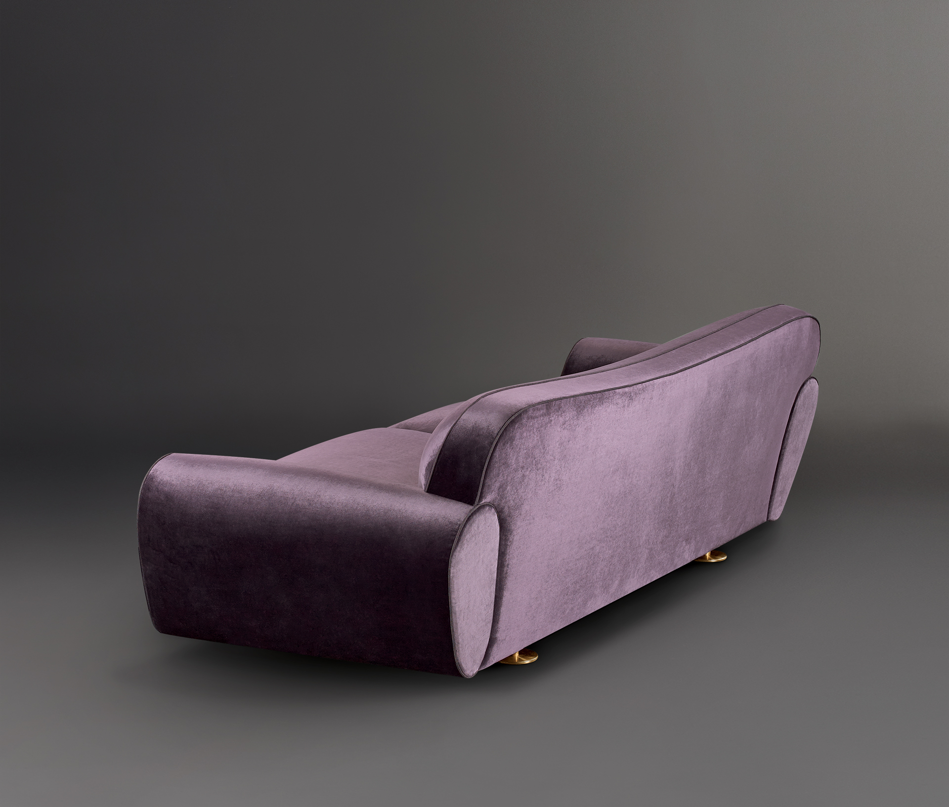Artù is a sofa covered in fabric with bronze feet, from Promemoria's catalogue | Promemoria