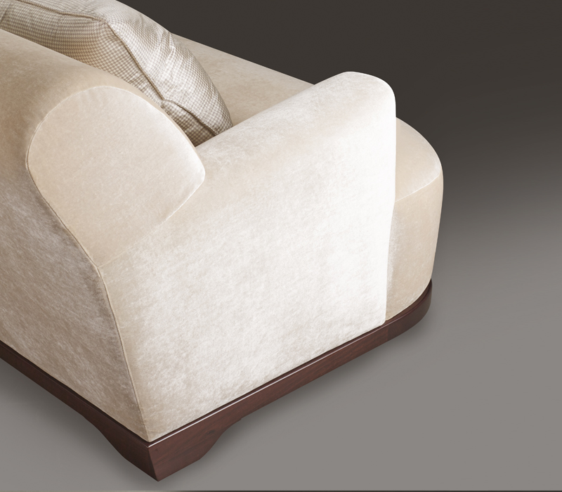 Dorian is a wooden sofa covered in fabric or leather that can be customized in size and shape, from Promemoria's catalogue | Promemoria