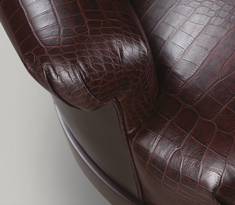 Detail of Gacy, a wooden sofa covered in fabric or leather, from Promemoria's catalogue | Promemoria