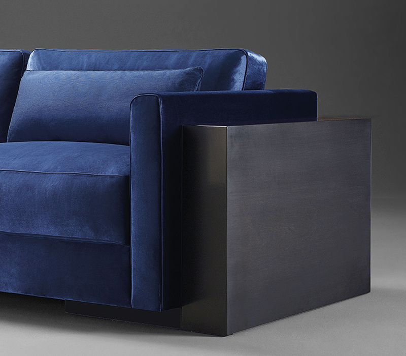 Detail of Ipparco, a wooden sofa with seat and back cushions in fabric, from Promemoria's Amaranthine Tales collection | Promemoria