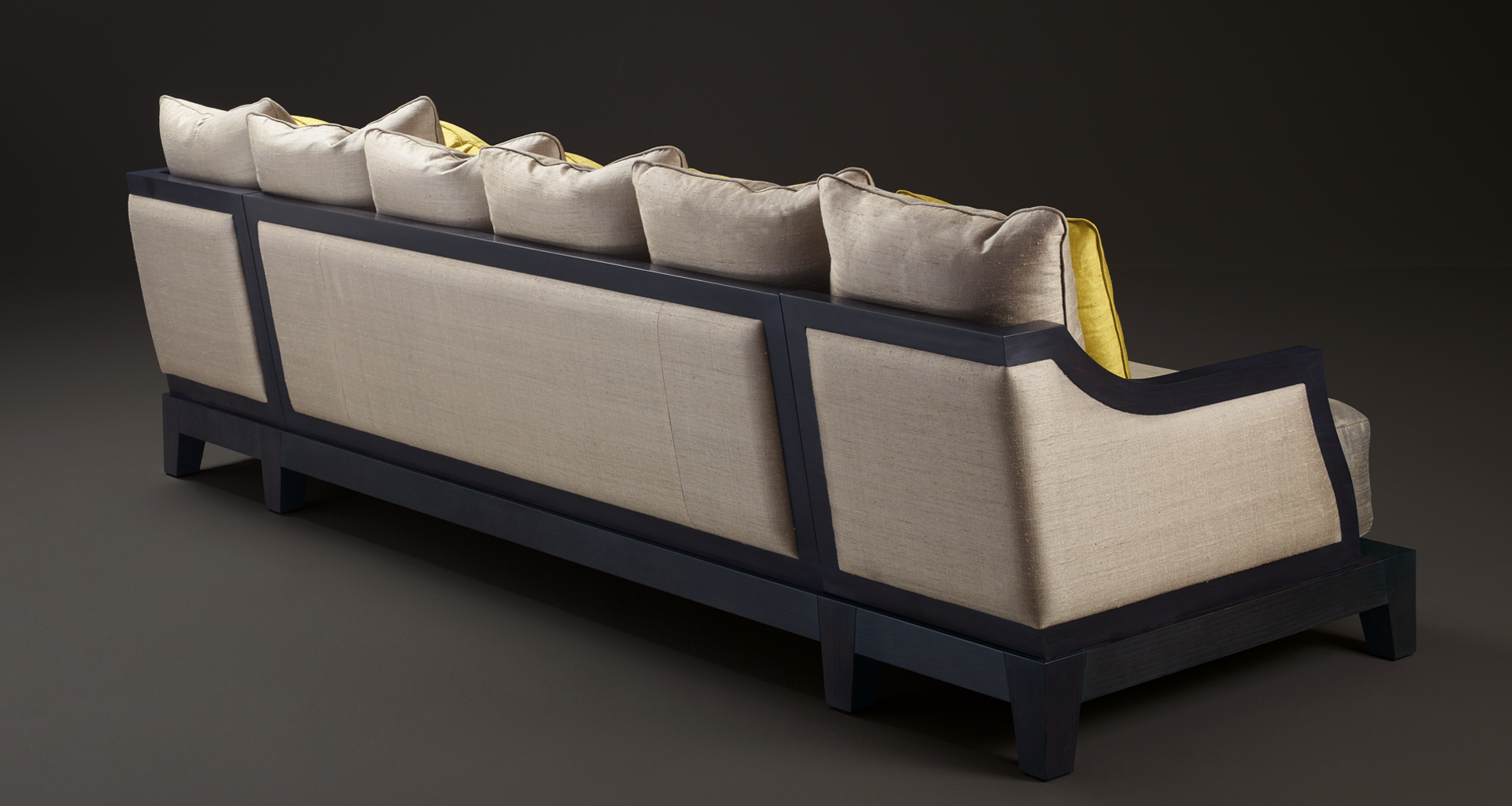 Lisandro is a wooden sofa with fabric covering and cushions, from Promemoria's Amaranthine Tales collection | Promemoria