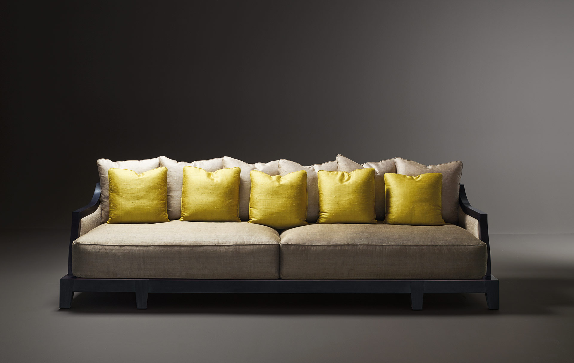 Lisandro is a wooden sofa with fabric covering and cushions, from Promemoria's Amaranthine Tales collection | Promemoria