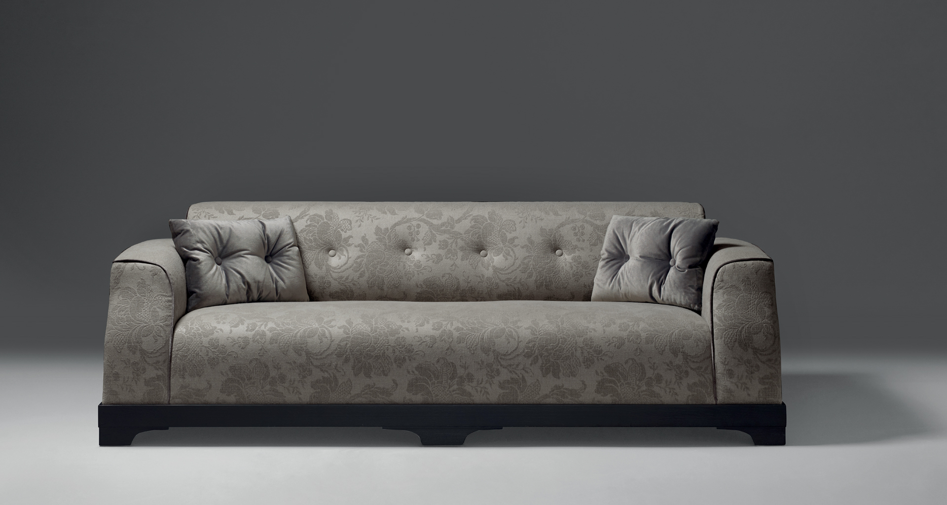 Mogador is a wooden sofa covered in fabric or leather with capitonnè backrest and cushions, from Promemoria's catalogue | Promemoria