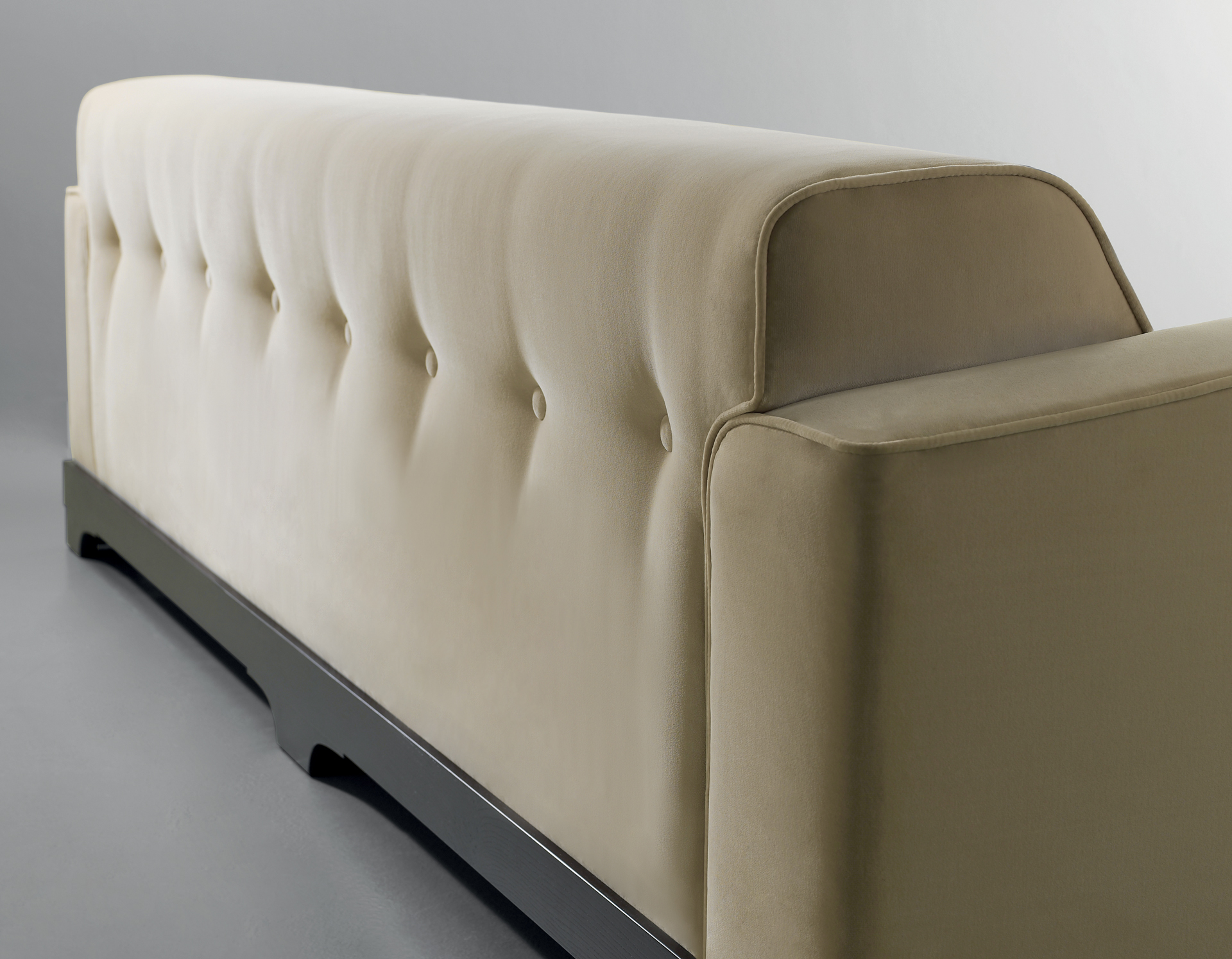 Mogador is a wooden sofa covered in fabric or leather with capitonnè backrest and cushions, from Promemoria's catalogue | Promemoria