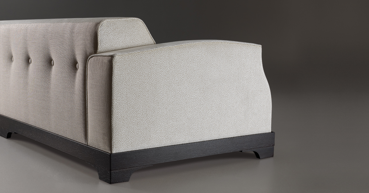 Mogador is a wooden sofa covered in fabric or leather with capitonnè backrest and cushions, from Promemoria's catalogue | Promemoria