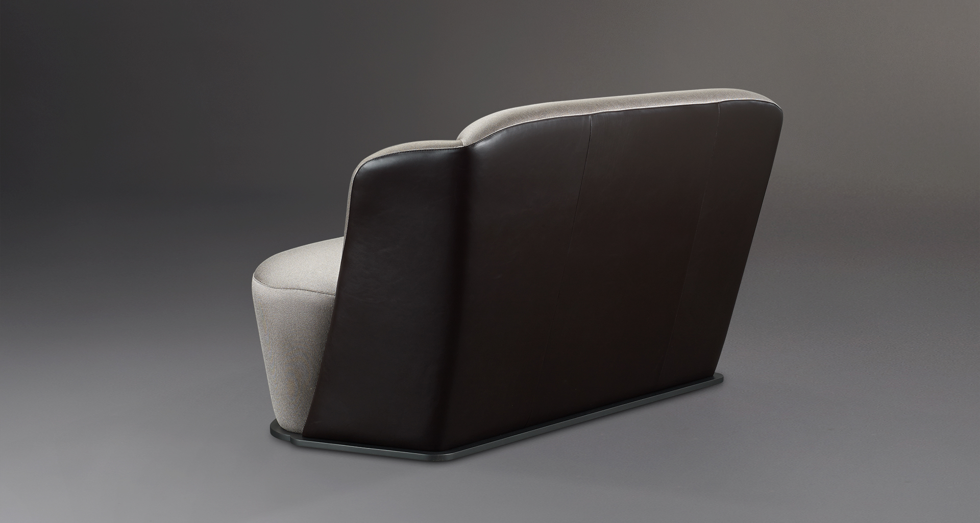 Backrest detail of Rosaspina, a sofa covered in fabric and leather with a metal base, from Promemoria's catalogue | Promemoria