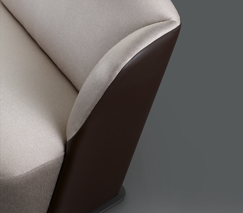 Detail of Rosaspina, a sofa covered in fabric and leather with a metal base, from Promemoria's catalogue | Promemoria