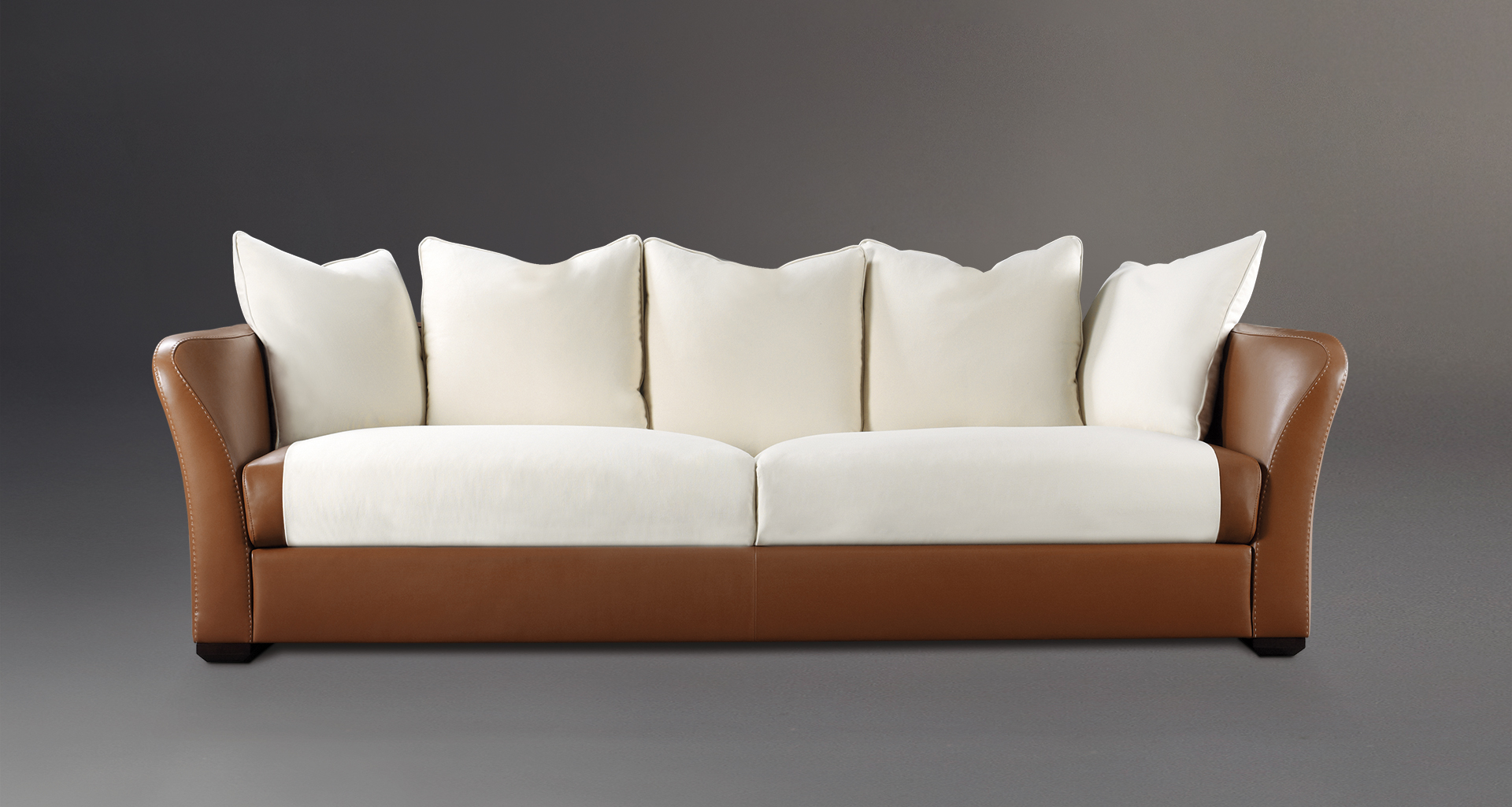 Shangri-la is a wooden sofa covered in leather and fabric, from Promemoria's catalogue | Promemoria