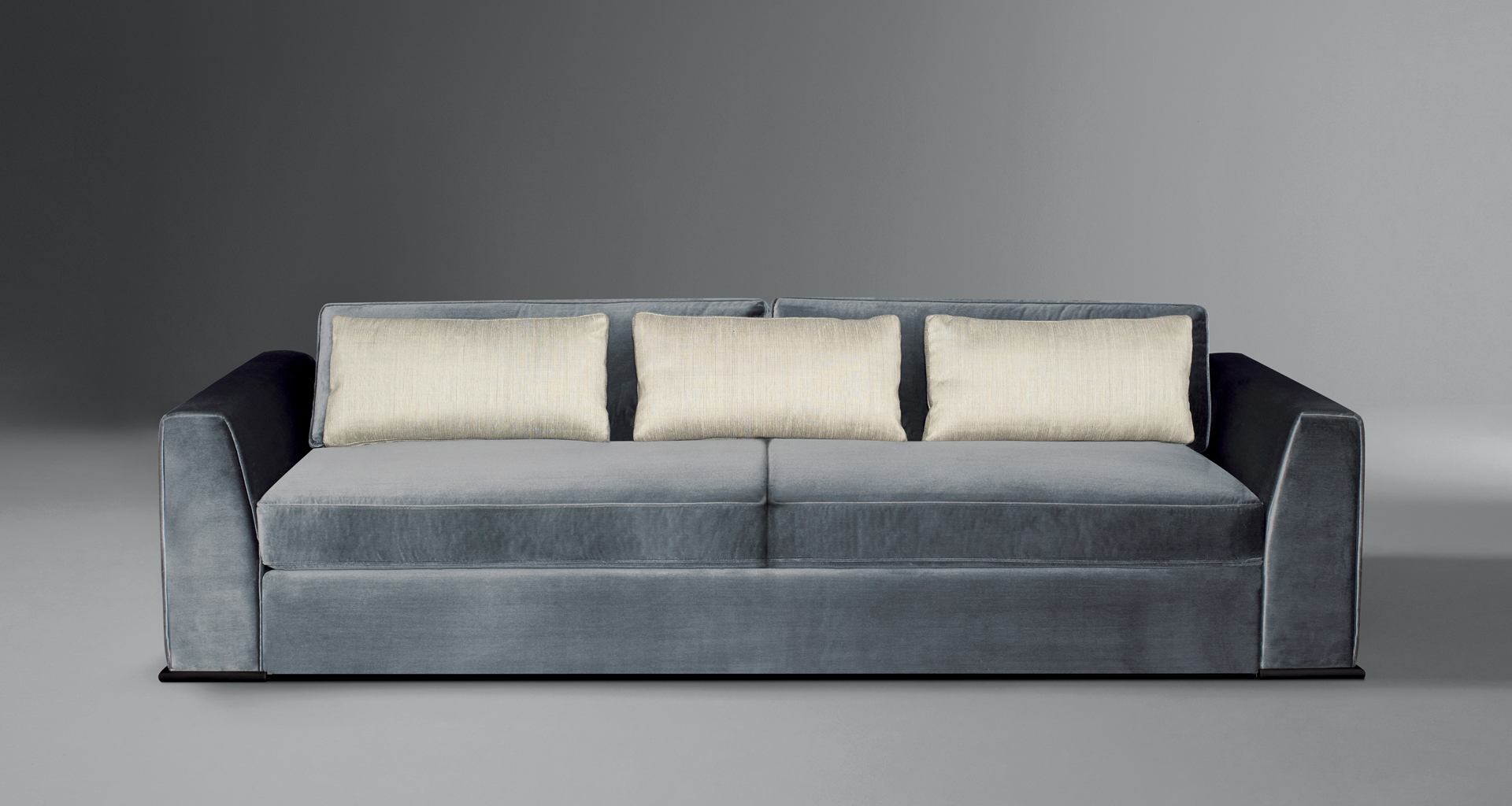 Ulderico is a wooden sofa covered in fabric, from Promemoria's catalogue | Promemoria