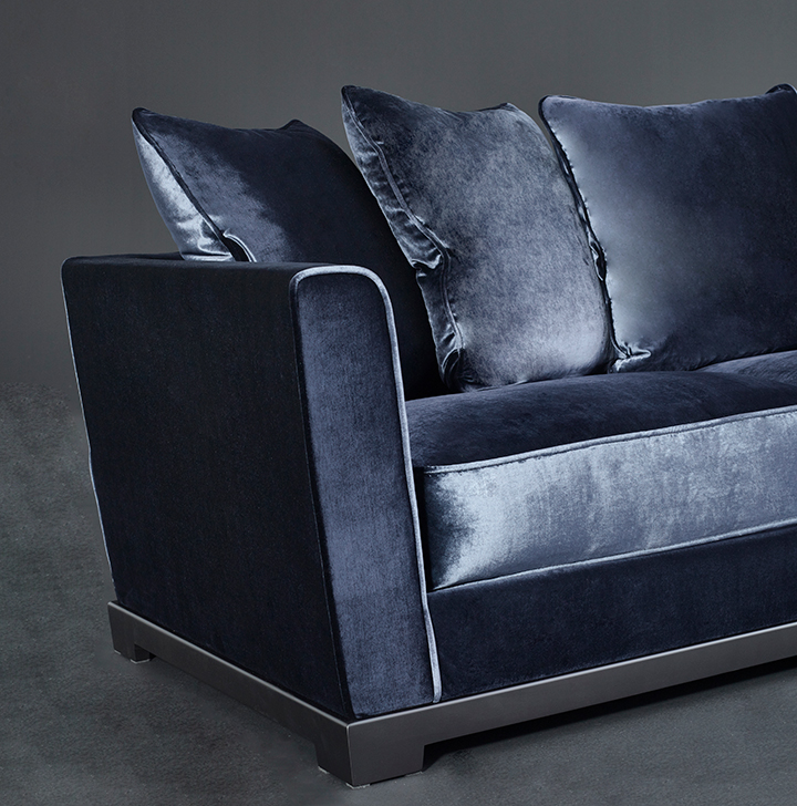 Detail of Wanda, a classic wooden sofa covered in fabric, from Promemoria's catalogue | Promemoria