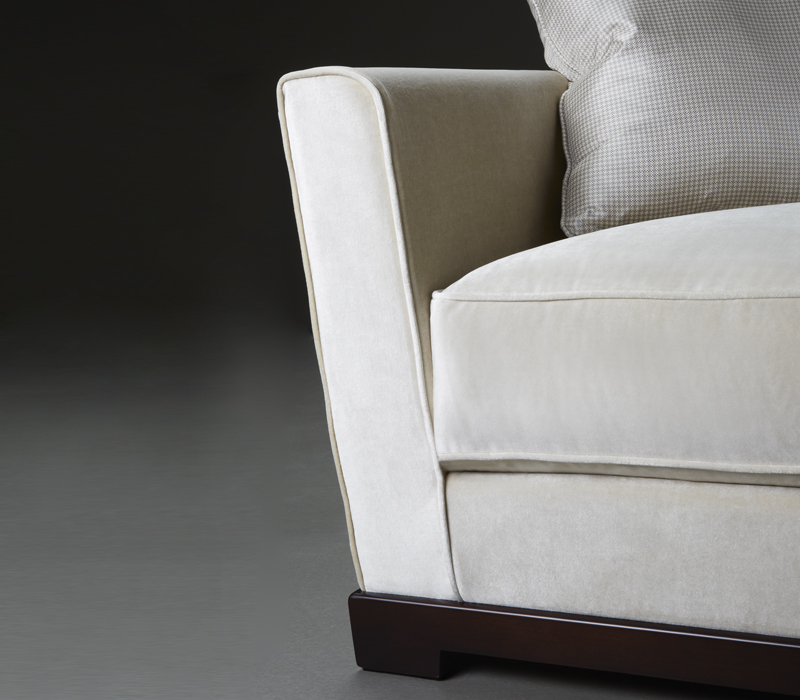Detail of Wanda, a classic wooden sofa covered in fabric, from Promemoria's catalogue | Promemoria