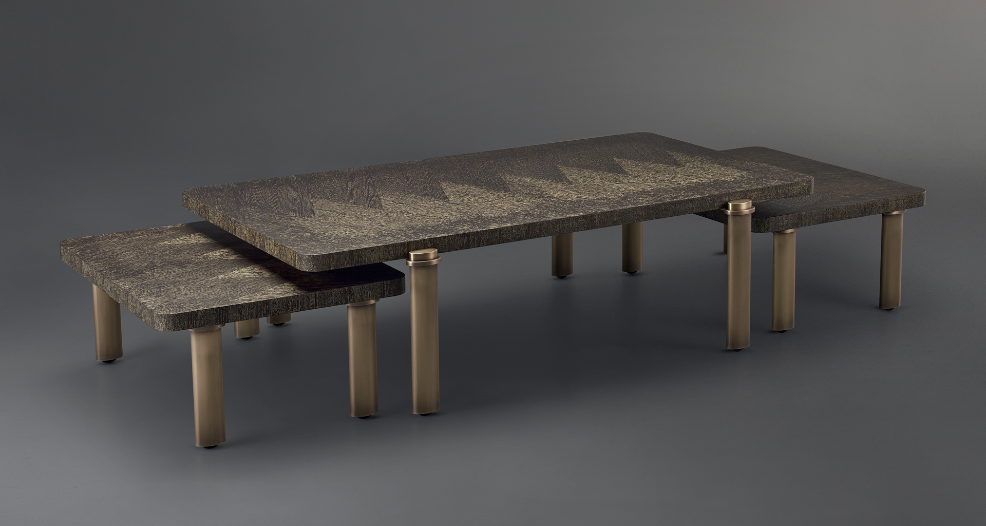Passepartout are two wooden coffee tables with wheels and bronze decoration, from Promemoria's catalogue | Promemoria