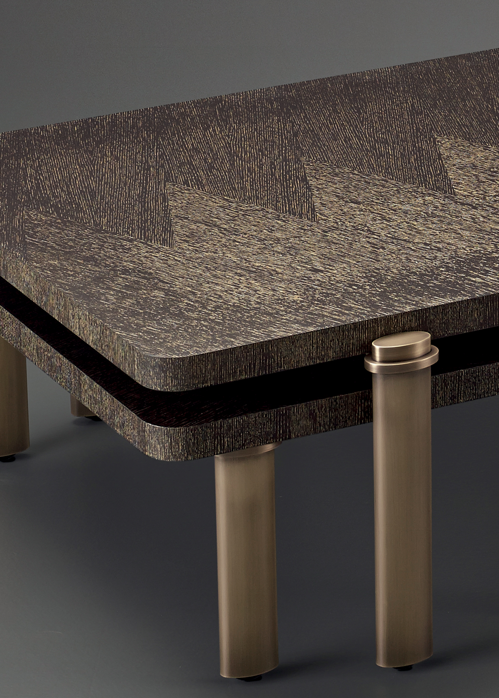 Bronze detail of Passepartout, two wooden coffee tables with wheels and bronze decoration, from Promemoria's catalogue | Promemoria