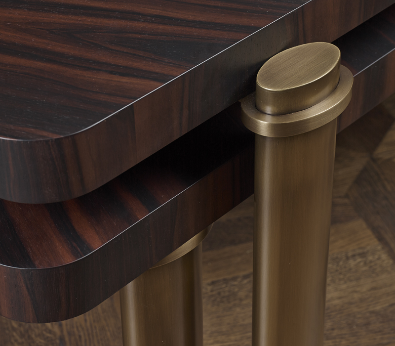 Bronze detail of Passepartout, two wooden coffee tables with wheels and bronze decoration, from Promemoria's catalogue | Promemoria