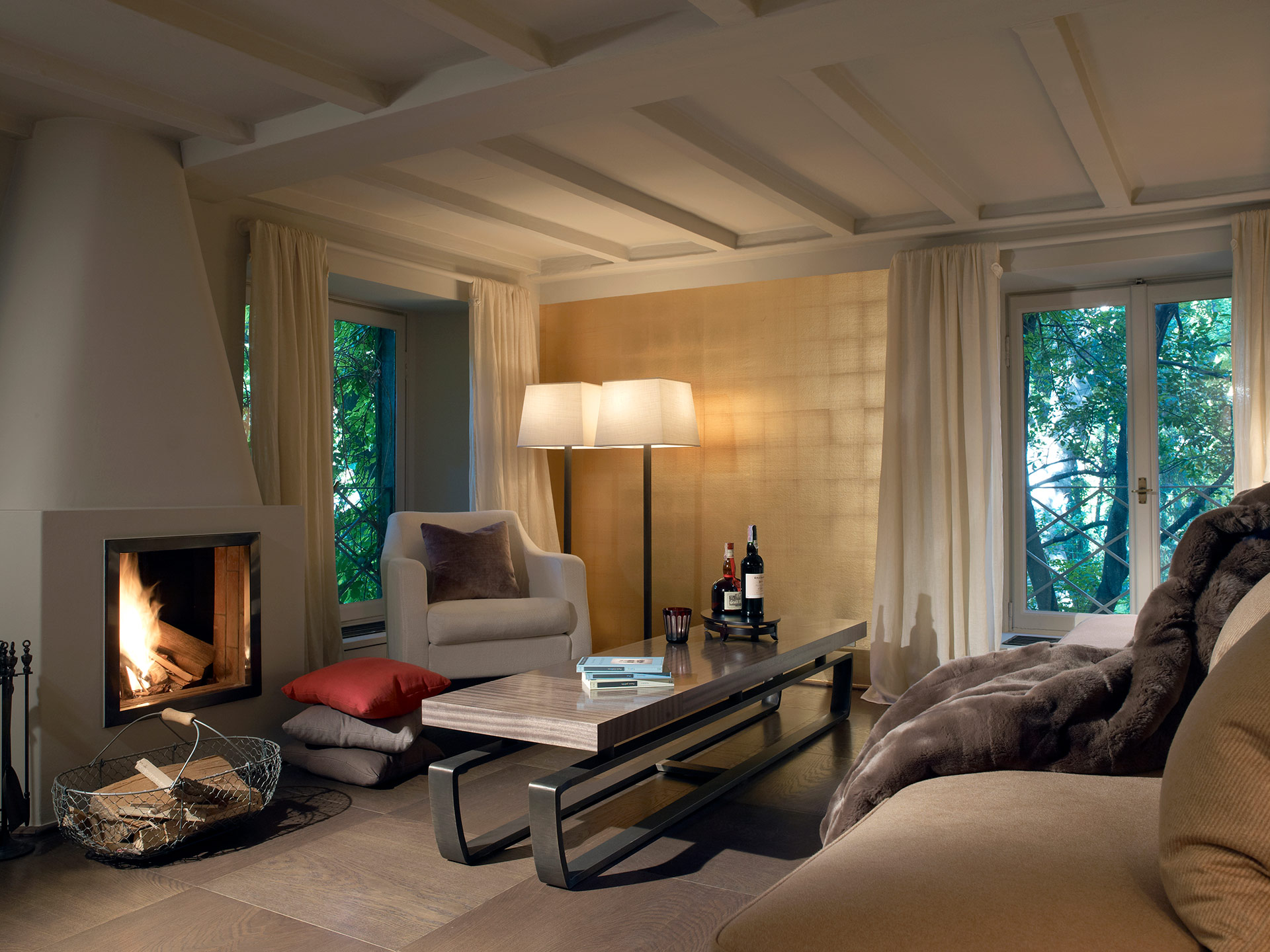 Saint Moritz is a coffee table with wooden top and bronze base, from Promemoria's catalogue | Promemoria