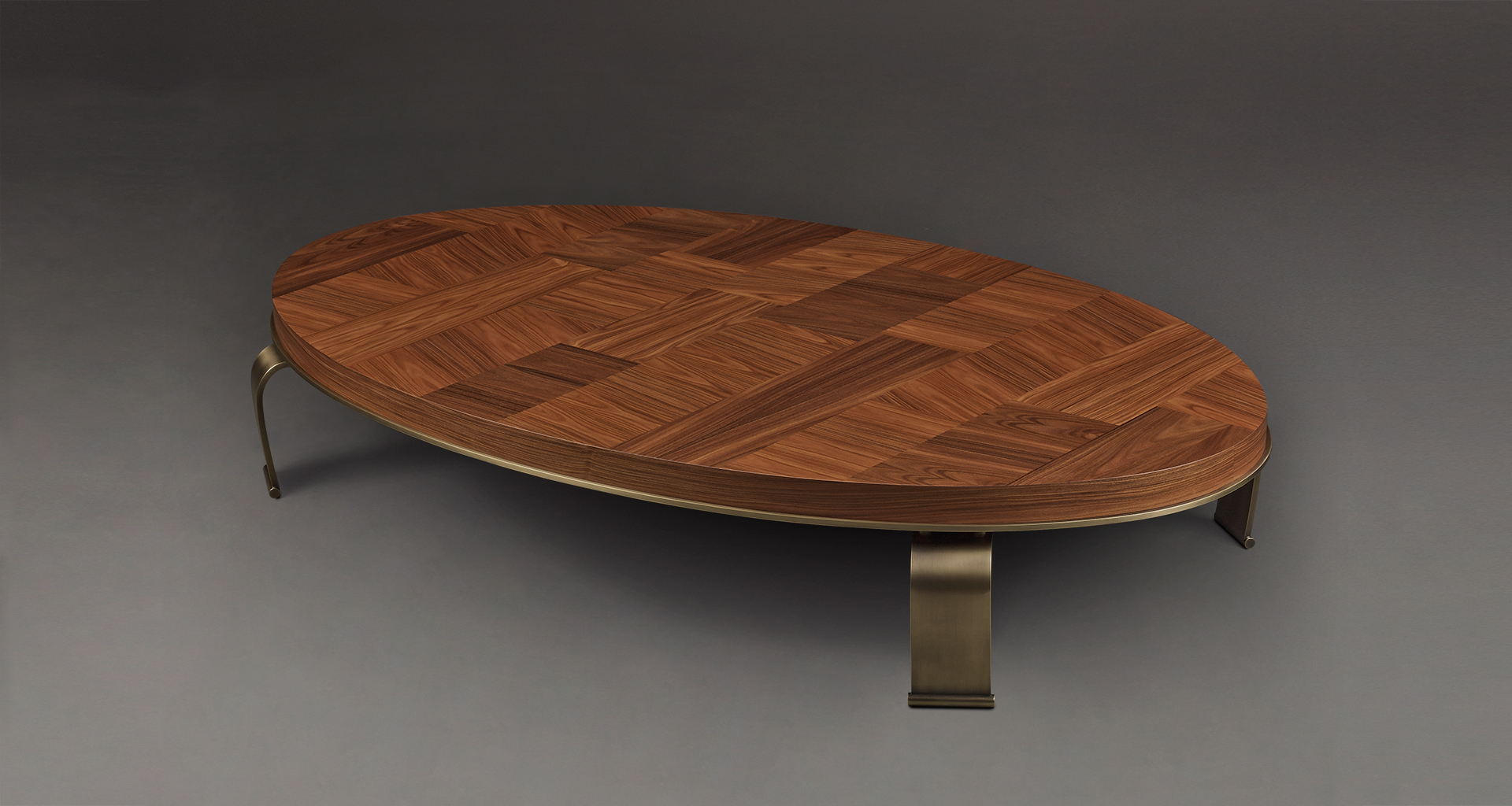 Sumo is an oval, rectangular or circular coffee table with wooden top and bronze legs, from Promemoria's Sun Tales collection | Promemoria