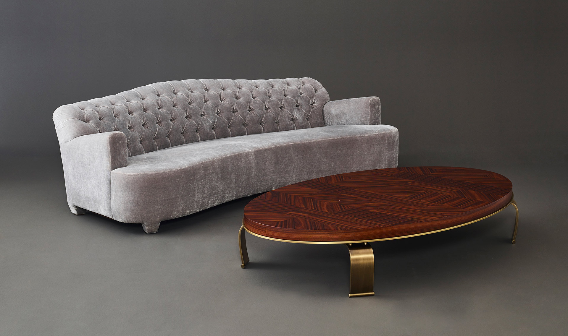 Sumo is an oval, rectangular or circular coffee table with wooden top and bronze legs, from Promemoria's Sun Tales collection | Promemoria