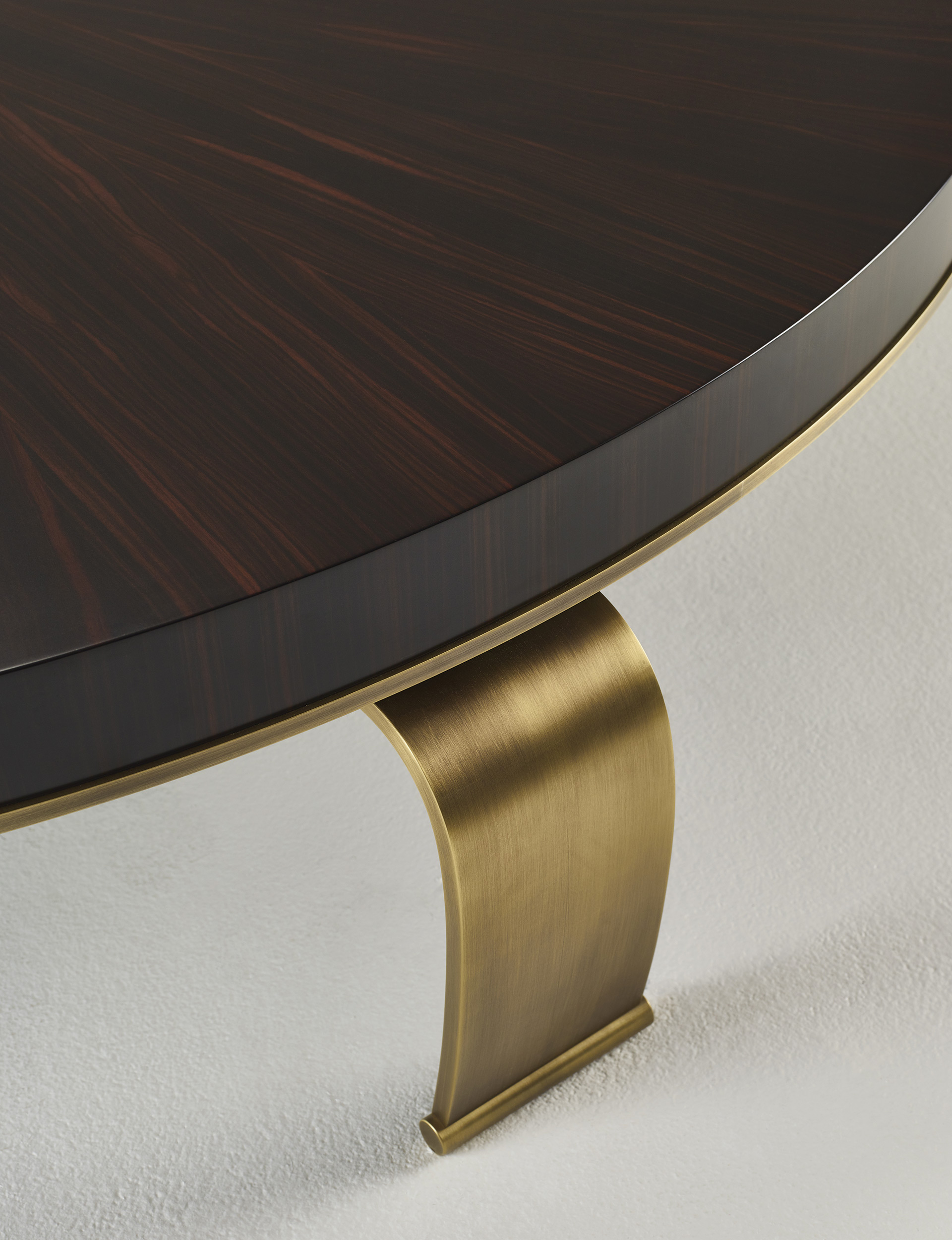 Sumo is an oval, rectangular or circular coffee table with wooden top and bronze legs, from Promemoria's Sun Tales collection | Promemoria