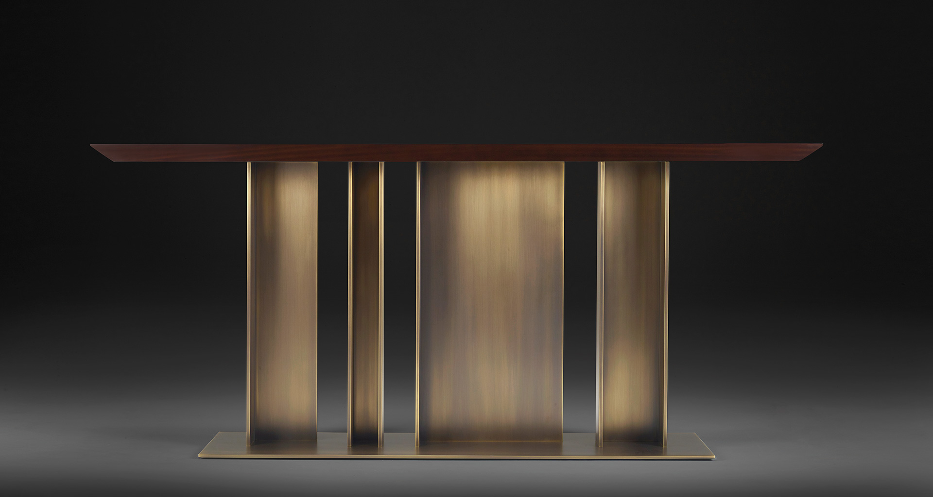 Nila is a console with bronze base and wooden top, from Promemoria's Indigo Tales collection | Promemoria