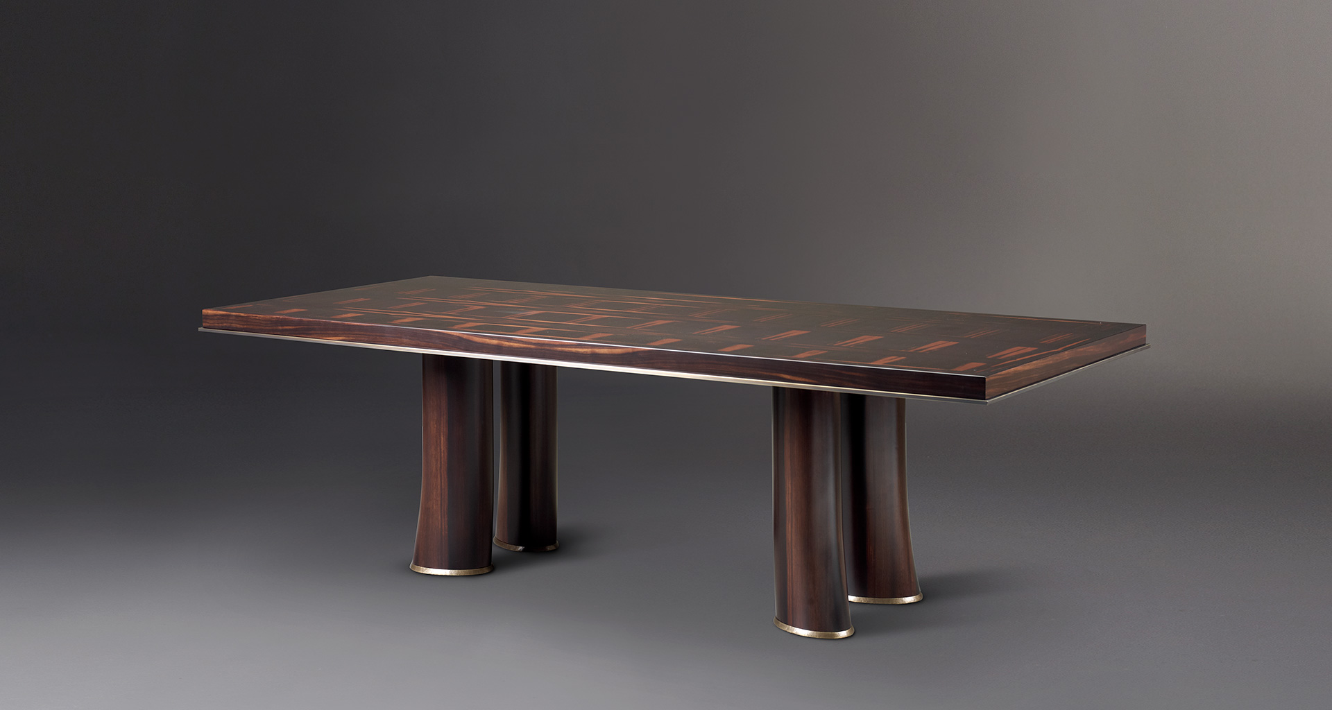 Andalù is a wooden dining table with bronze profile and feet, from Promemoria's catalogue | Promemoria