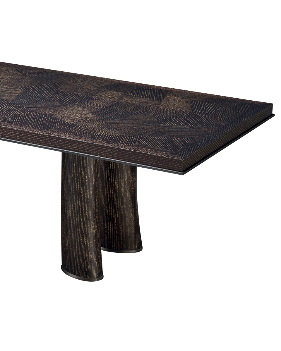 Detail of Andalù, a wooden dining table with bronze profile and feet, from Promemoria's catalogue | Promemoria