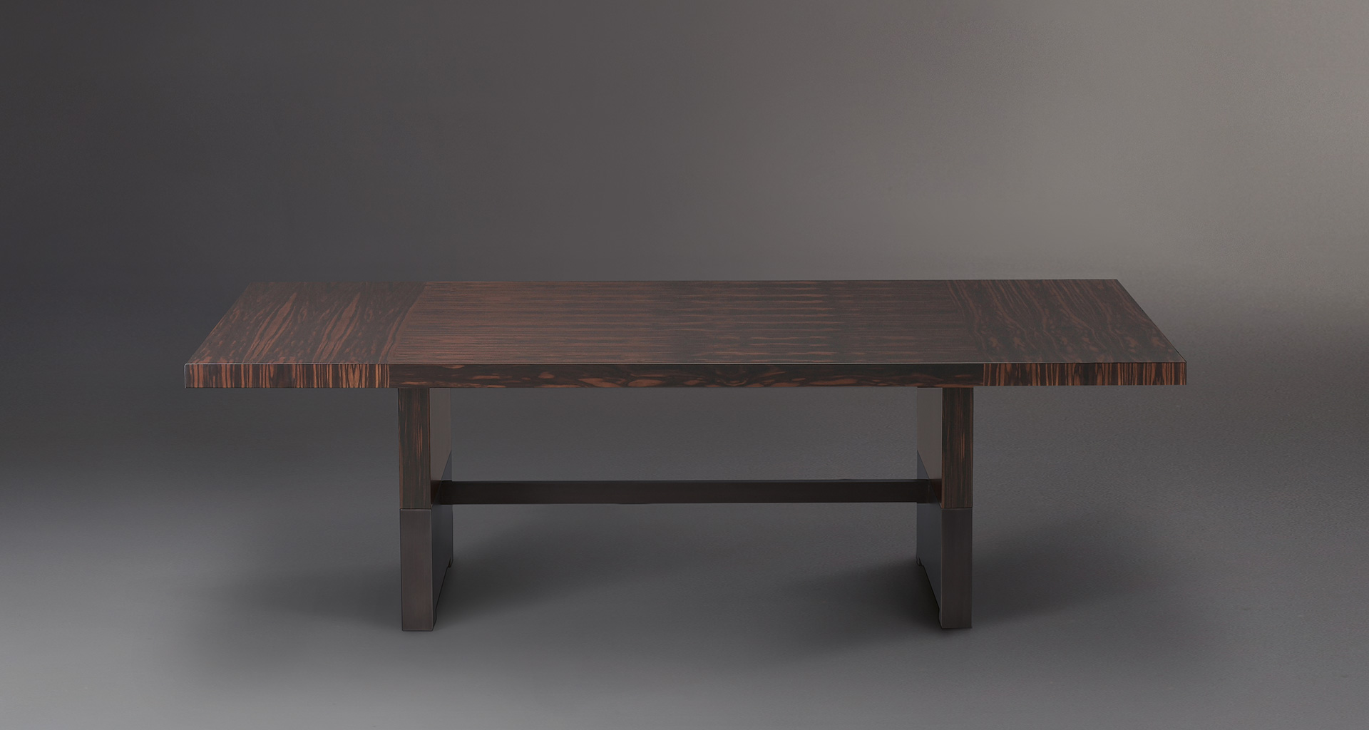 Bamboo is a wooden dining table with a bronze base, from Promemoria's catalogue | Promemoria